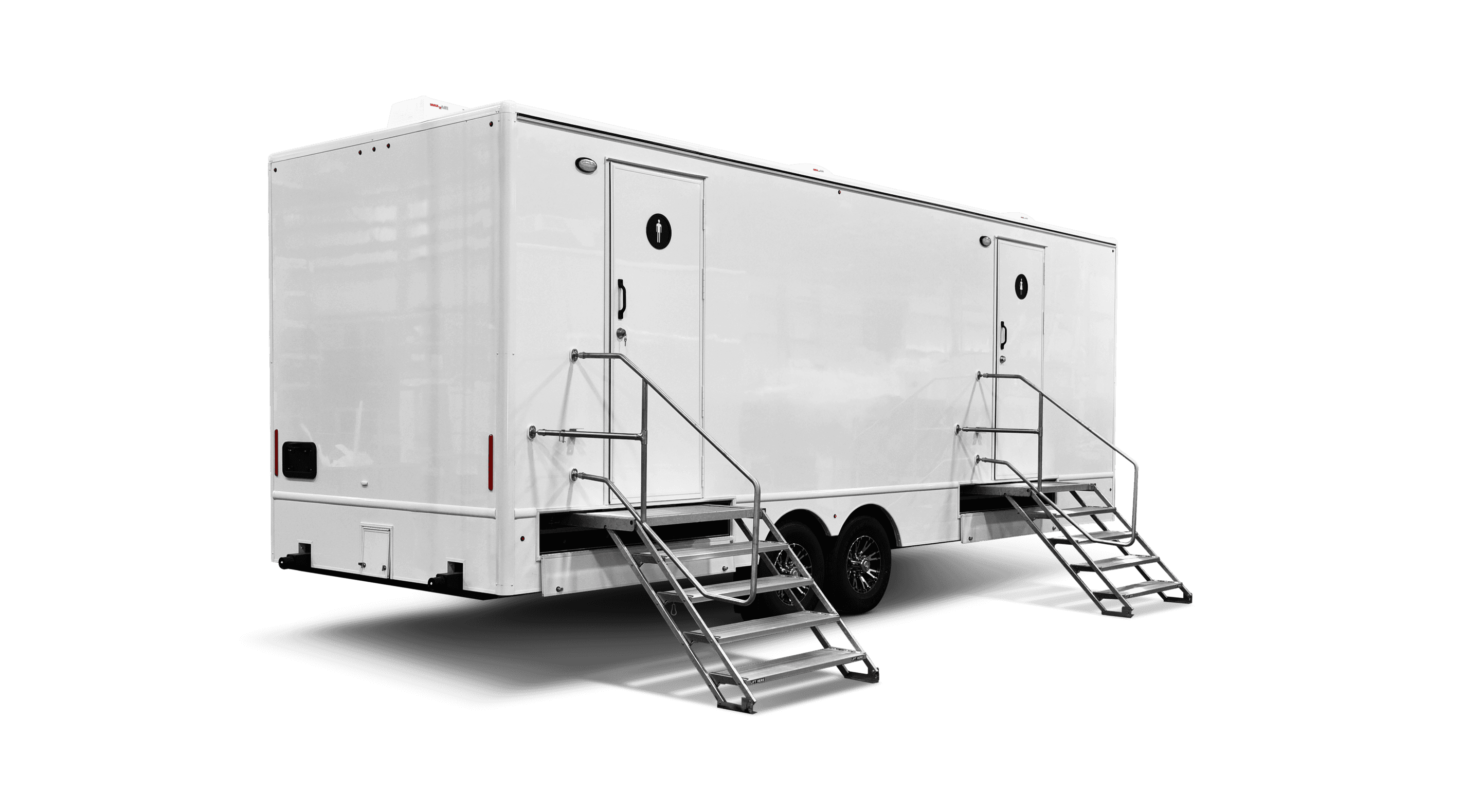 Large white mobile restroom trailer featuring two separate entrances with metal stairs and handrails.